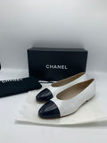 Vintage Chanel ballerinas in white leather with black cap toe - Dyva's Closet