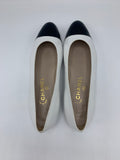 Vintage Chanel ballerinas in white leather with black cap toe - Dyva's Closet