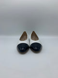 Vintage Chanel ballerinas in white leather with black cap toe - Dyva's Closet